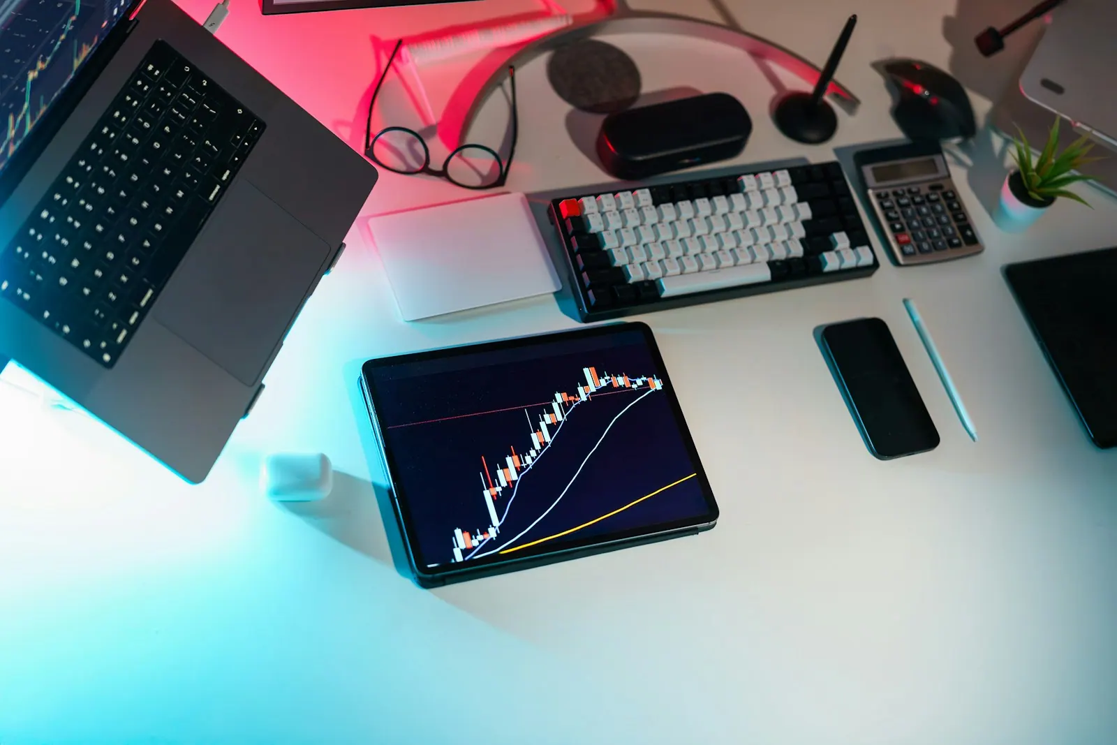 A laptop computer sitting on top of a white desk finance office space crypto currency chart laptop tablet business analytics. Analytics tools examples compared: what the good ones share