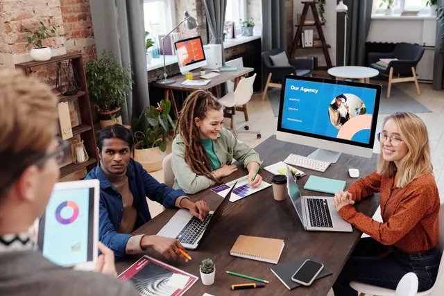 Team of diverse colleagues collaborating on project in modern office with digital devices and charts. What best discovery platforms agencies involves in practice
