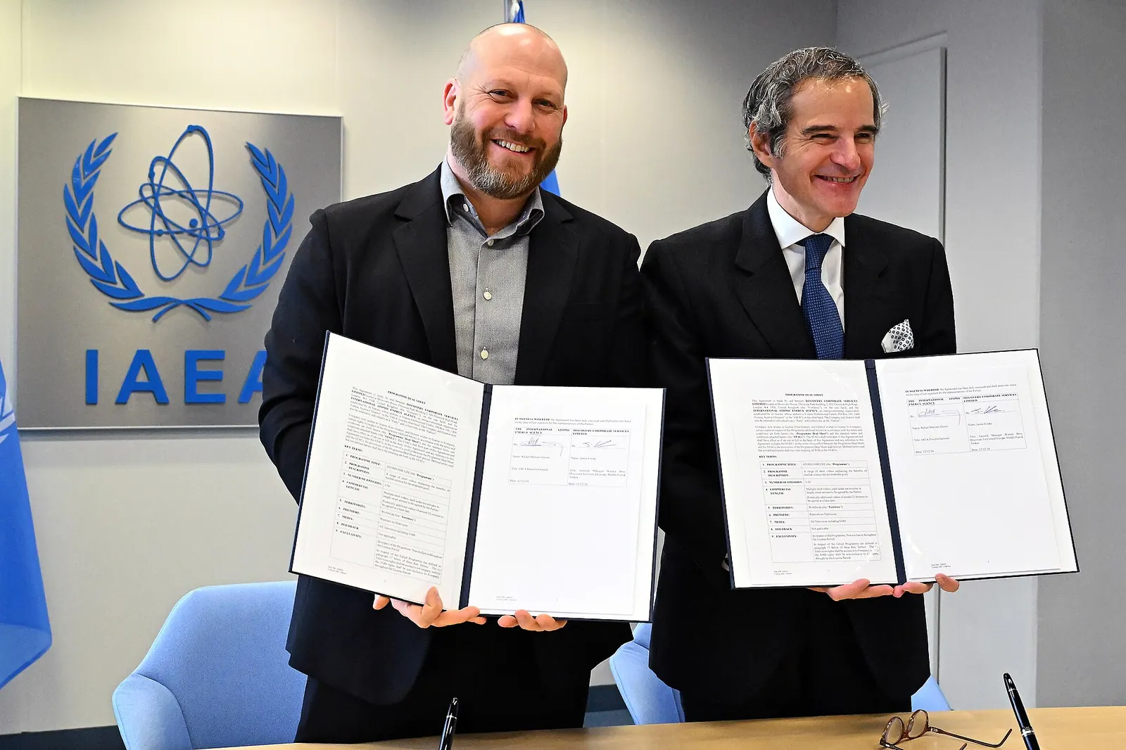 IAEA Director General Rafael Mariano Grossi and Jamie Cooke, General Manager Warner Bros. Discovery for Central Europe, Middle East &amp; Turkey, signs the agreement between the In. Discovery platforms examples: lessons and useful context