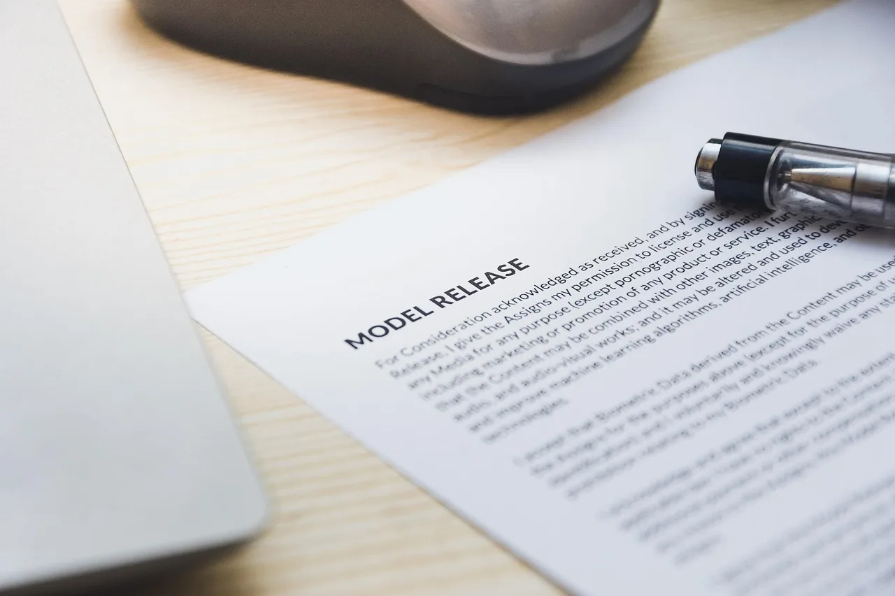 paper, model release, form, document, signing, pen, desk, agreement, business, contract, signature. Discovery platform contracts: five checks before you sign